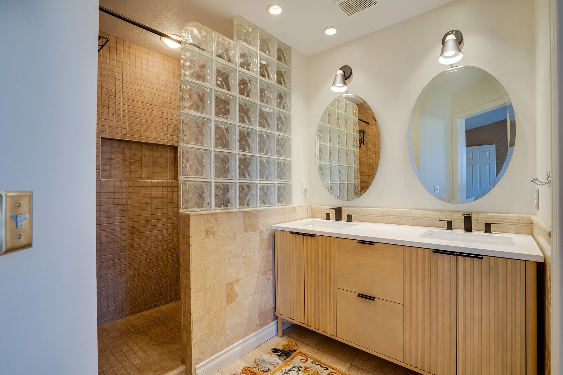 Bathroom with double vanity and mirrors