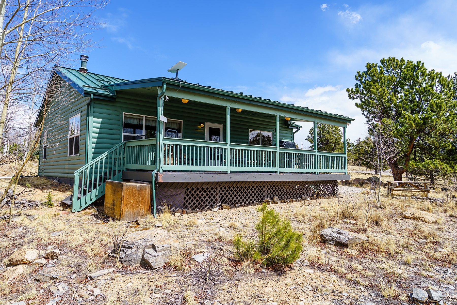 Home exterior with a wraparound covered deck