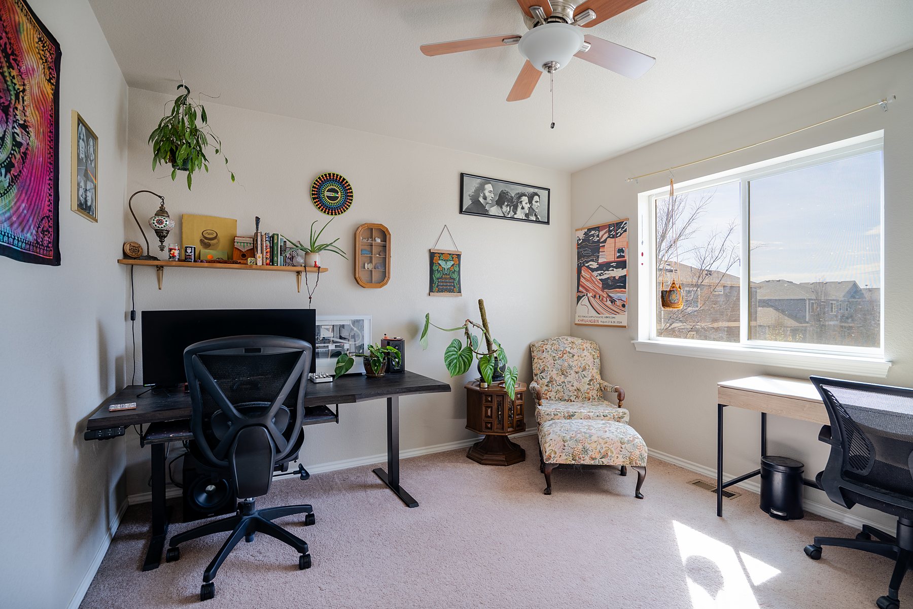 Home office with plants and a bright window